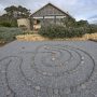 asian rock garden with pea gravel and mexican beach pebbles creating a labyrinth without plants