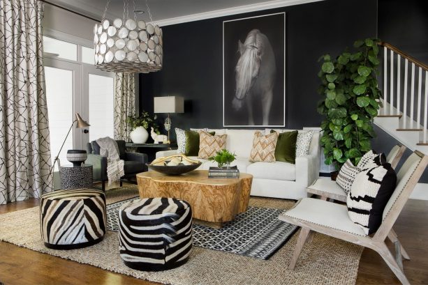 black wall accentuated by brown wood element in a white living room