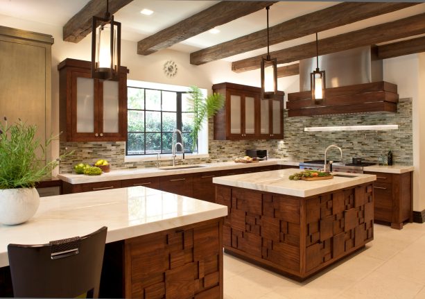 combination of light countertops, sea-green, and silver color scheme paired with dark wood cabinets to add warmth