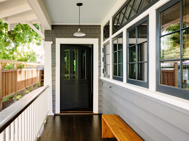 farrow and ball - pointing clean craftsman-style trim paired with single hung windows painted in benjamin moore - black tar