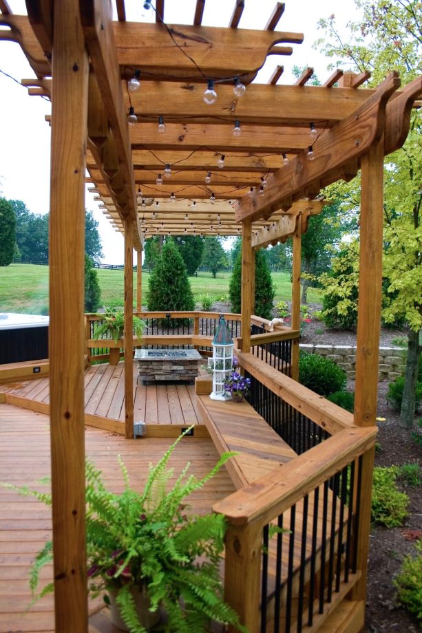 freestyle floating deck with a pergola and a railing