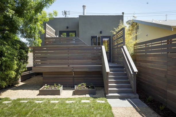 gravel landscaping with planter boxes under the deck