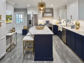 gray ciudad kitchen floor tile with dark blue cabinets