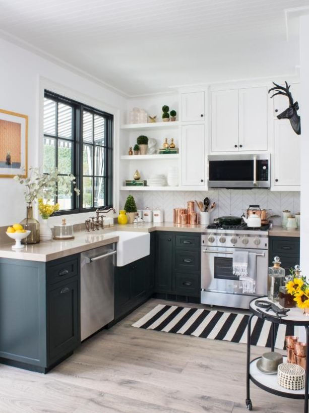 gray kitchen floor with black and white runner and deep dark green cabinets