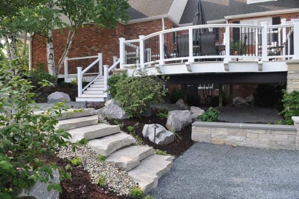 rock under deck landscaping with boulders and no plants
