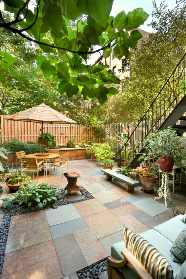 a well-composed townhouse patio with several seating areas