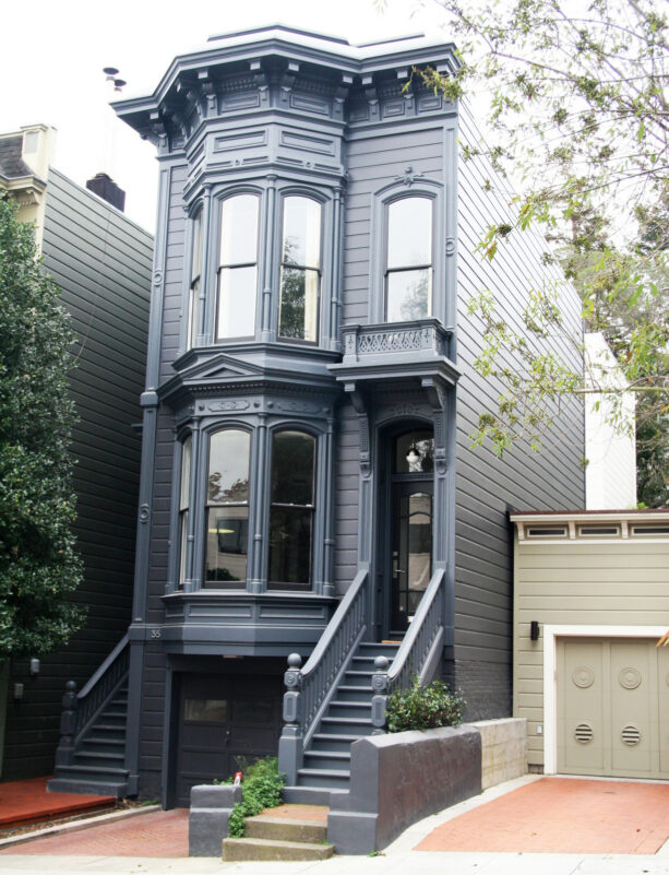 all-black bay window exterior in a victorian house