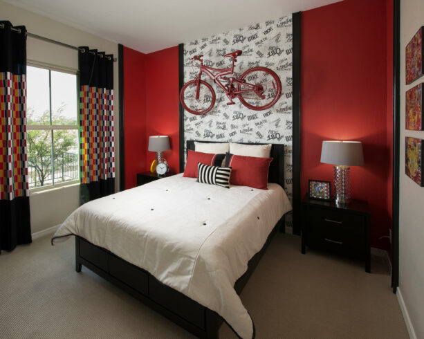 black and white wallpaper on a bright red accent wall