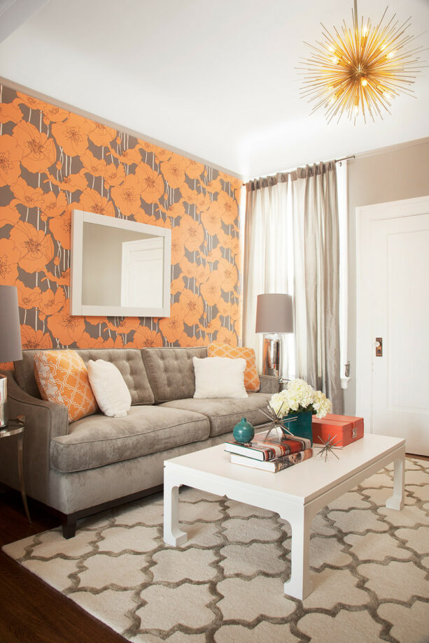 graphic wallpaper accent wall in orange and gray to add a pop of color