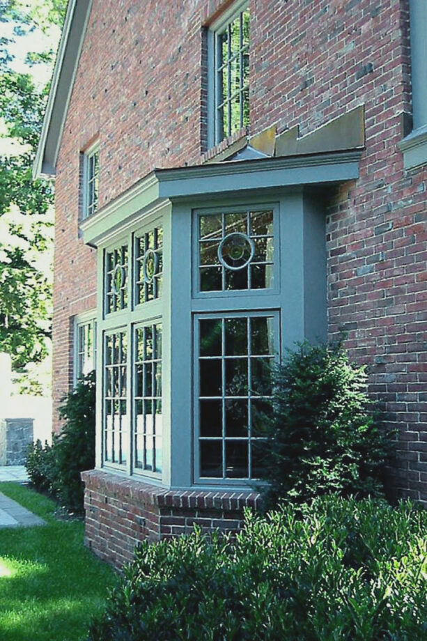 green painted trim in a bay window exterior