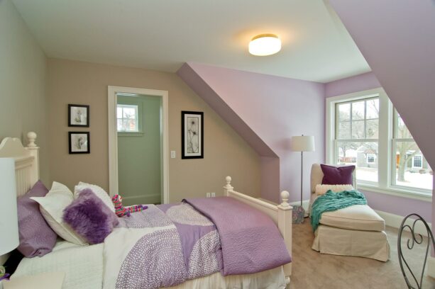 light purple accent wall with white double hung windows and slanted walls