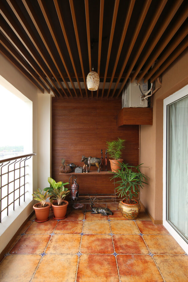 orange tiled flooring from spain add a mediterranean look to the balcony