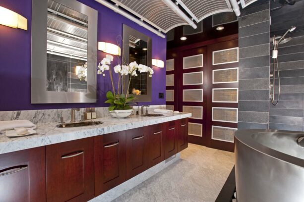 purple accent wall painted in benjamin moore - gentle violet paired with gray and dark wood elements