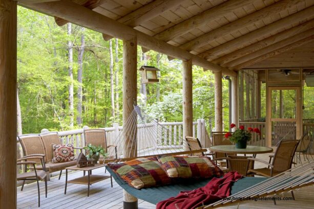 spacious log cabin porch made of heavy round timbers as a statement