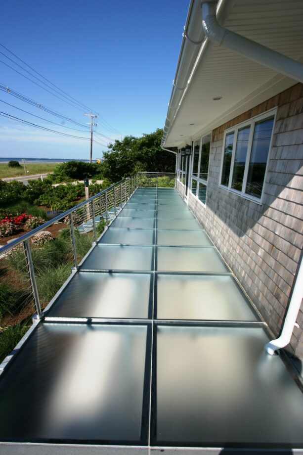 the idea of using glass panels as balcony flooring