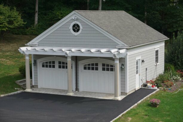 a pergola was completed with three columns over the garage door