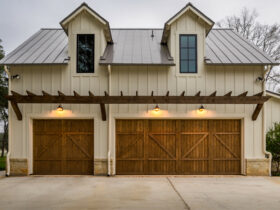 barn garage doors with a pergola over them