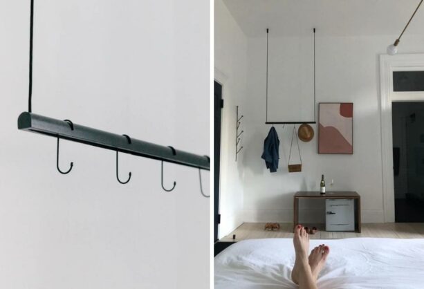 black mounted modern styled hanging clothes rack from ceiling