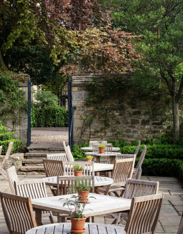 country styled restaurant patio with a traditional walled garden