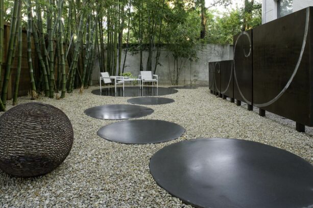 modern landscaping idea in the side yard with a cor-ten steel wall as a screen