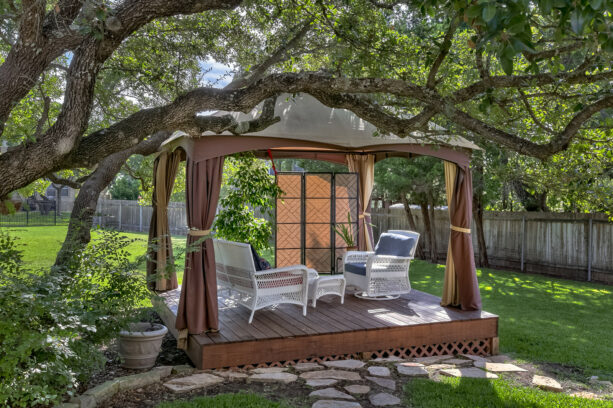 secluded gazebo with curtains on a deck