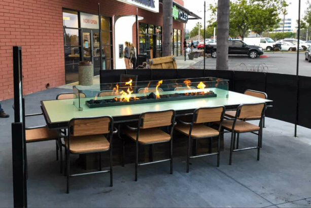 urban restaurant patio equipped with a comfortable built-in fire table