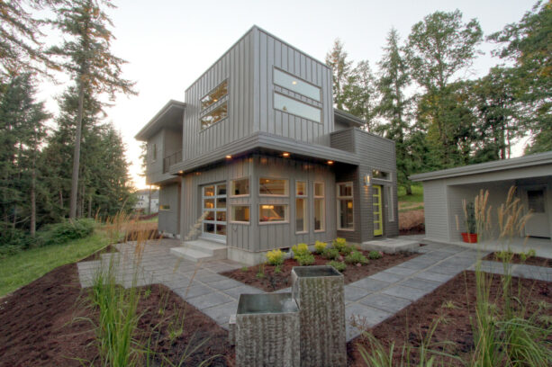 vertical metal, hard panel, and hardi-plank lap siding to create a midcentury modern exterior