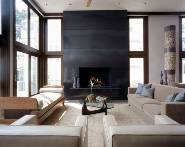 a black metal fireplace surrounds to create a modern look