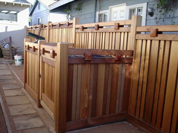 cedar craftsman-style fence with dumpster enclosure