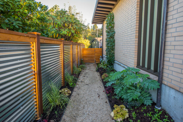 corrugated metal surrounded by lumber frame mid-century modern fence