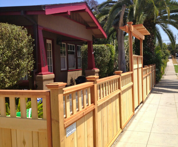 craftsman-style fence with a gate and an arbor