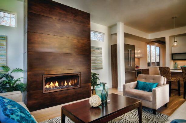gas fireplace surrounded by antique copper metal
