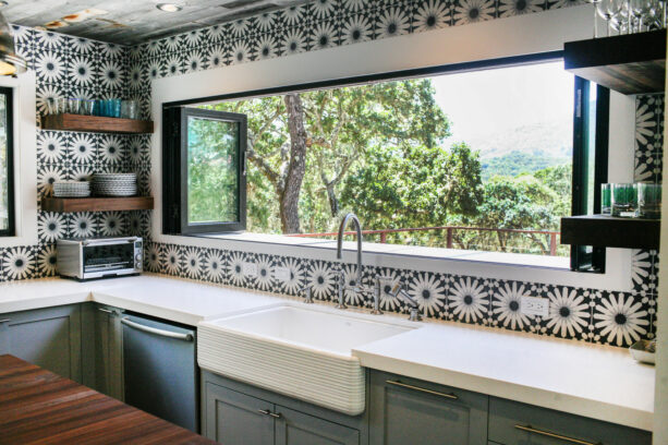 graphic-designed backsplash around a folding kitchen window