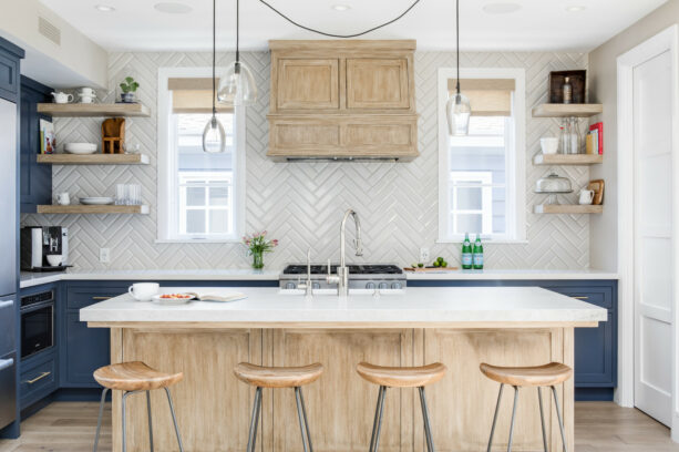 herringbone patterned tile backsplash around the kitchen windows
