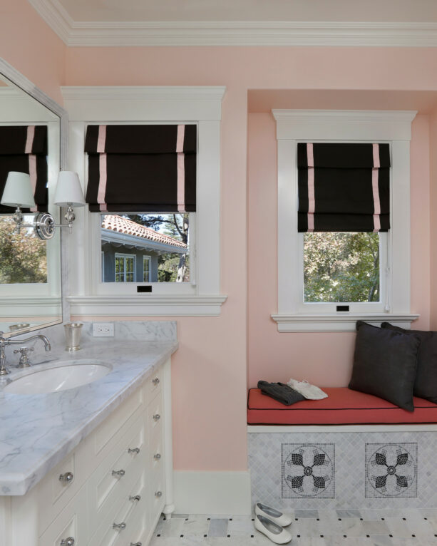 mediterranean bathroom with pink walls and gray tile