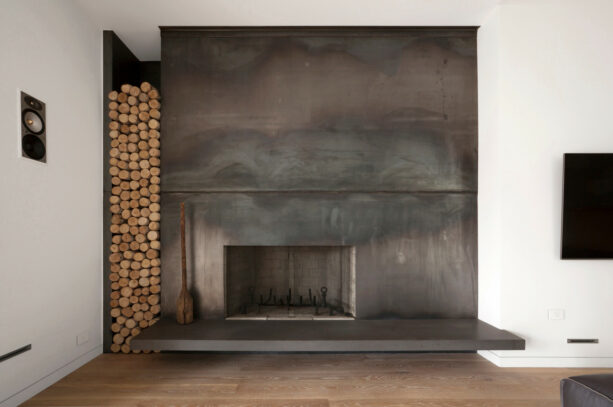 minimalist fireplace with steel-clad surround