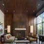 oxidized metal surround fireplace with wood wall and ceiling paneling
