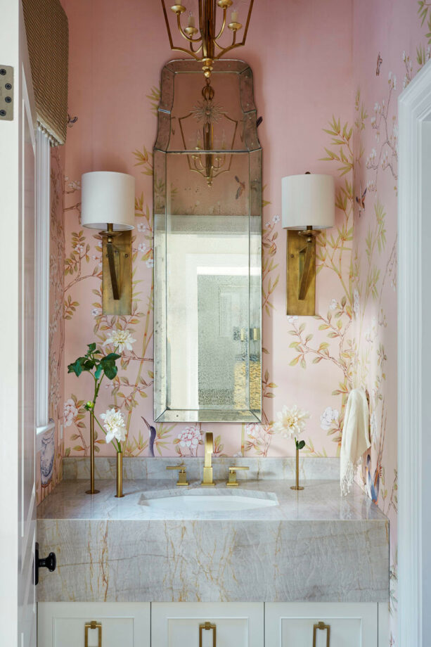 rose pink mural on a bathroom wall with gray countertop