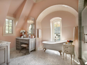 soft coral pink bathroom wall paired with gray furniture