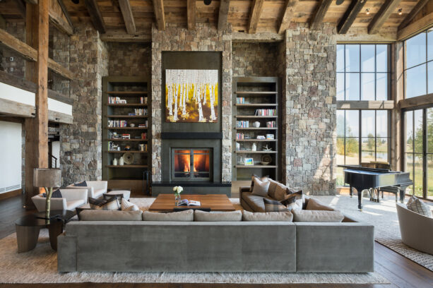 standard fireplace with metal surrounds in a rustic living room